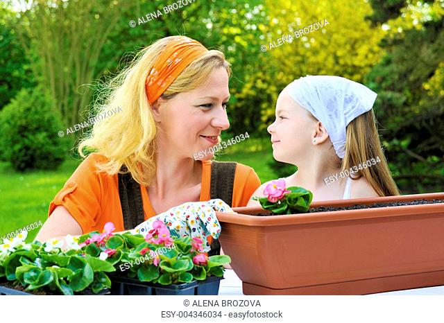 Mother, daughter having gardening time