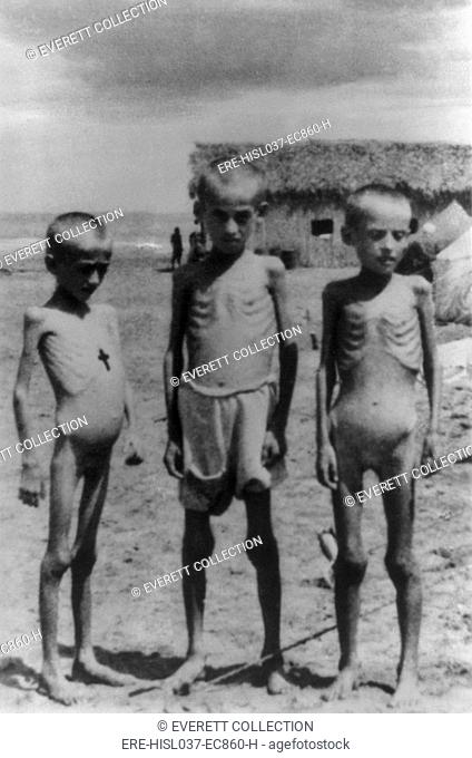 Three emaciated Polish refugee children who have escaped to Iran during World War 2. Ca. 1940-44. (BSLOC-2014-10-169)