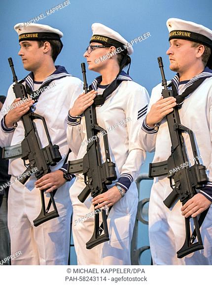 German marines carry Heckler and Koch G36 rifles during a flag parade on the frigate 'Karlsruhe' in Haifa, Israel, 11 May 2015