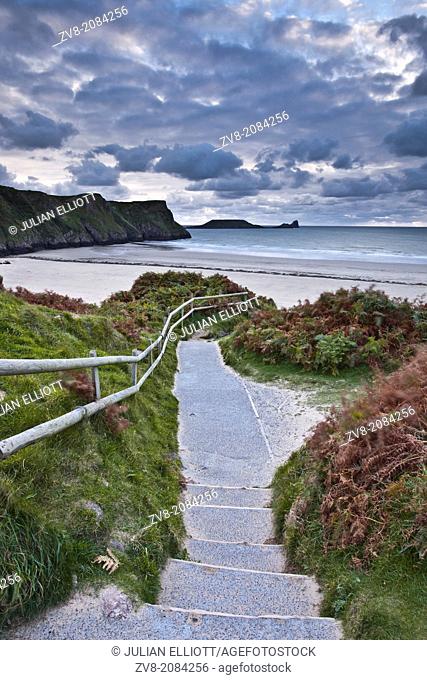 Looking down to the beach at Rhossili Bay on the Gower Peninsula, Wales. The rock known as the Worm can be sound in the background