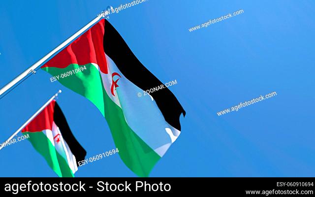 3D rendering of the national flag of Sahrawi Arab waving in the wind against a blue sky