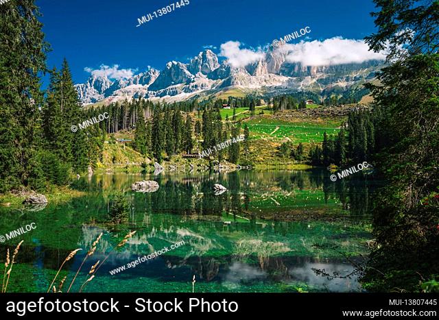Carezza lake - Lago di Carezza, Karersee with Mount Latemar, Bolzano province, South tyrol, Italy. Landscape of Lake Carezza or Karersee and Dolomites in...