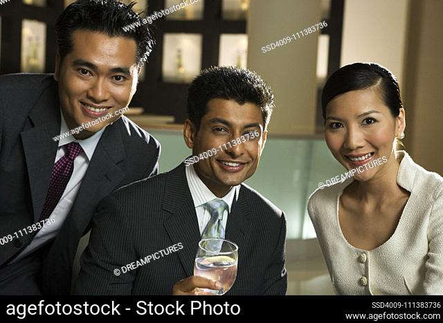 Smiling business people in restaurant