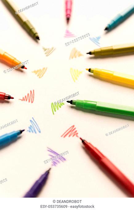 Strokes painted with colorful markers on white paper. Markers sending out wi-fi
