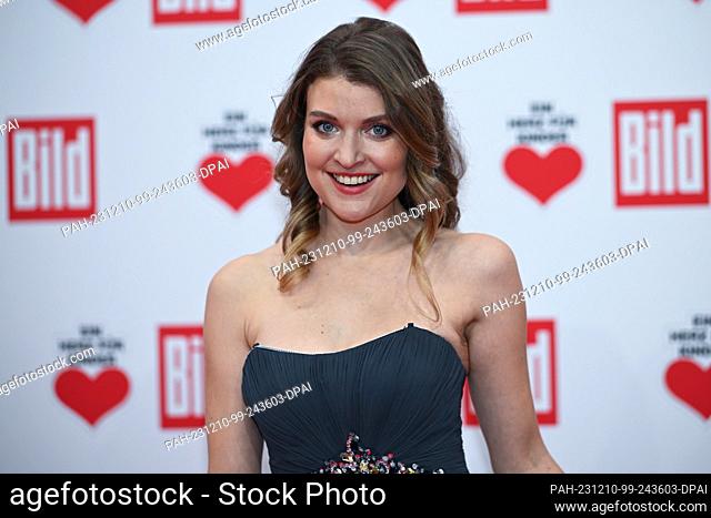 09 December 2023, Berlin: Lara Mandoki, actress, stands on the red carpet of the TV fundraising gala ""Ein Herz für Kinder""