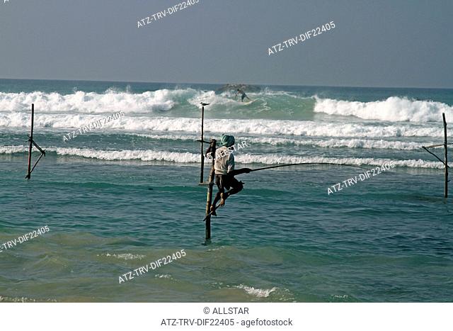 LONE STILT FISHERMAN & SURFER; WELIGAMA, SRI LANKA, ASIA; 18/03/2013