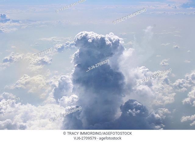 Aerial shot flying over and through cumulonimbus and cumulus clouds over Mexico