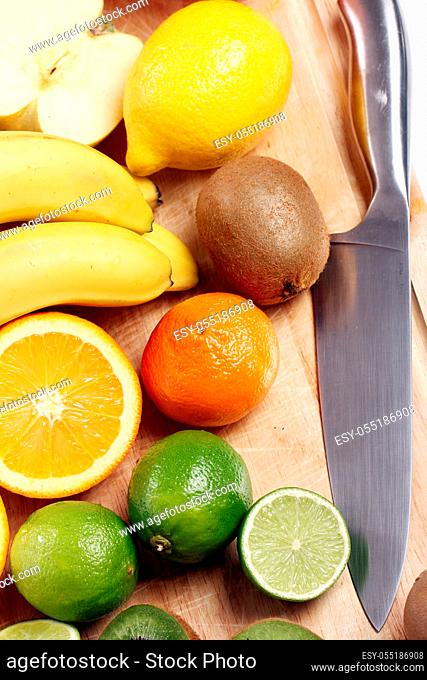 Fresh and colorful fruits on wooden board