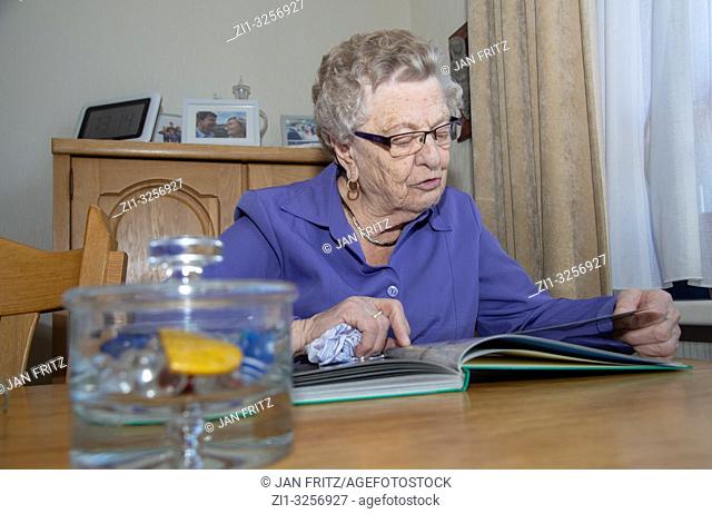 old woman reading book