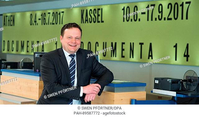 The new managing director of Kassel Aiport, Lars Ernst, smiles during his introduction in front of a terminal of Kassel Airport in Calden, Germany, 4 April 2017