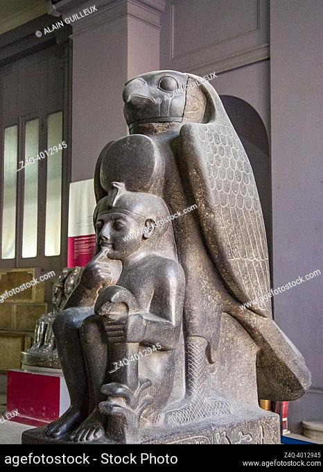 Cairo, Egyptian Museum, Ramses 2 as a child, protected by the hawk god Horoun. Granite, from Tanis. Cryptographic name of the king : Ra Mess Sou