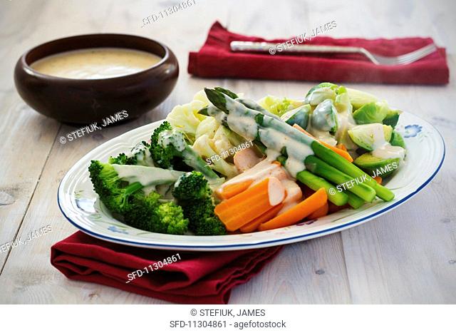Steamed vegetables with cheese sauce