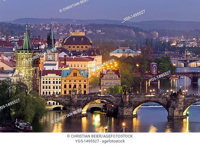 View along the Vltava River in Pragues Old Town in the evening with Old Town Bridge Tower, Charles Bridge, National Theatre, Prague, Bohemia, Czech Republic