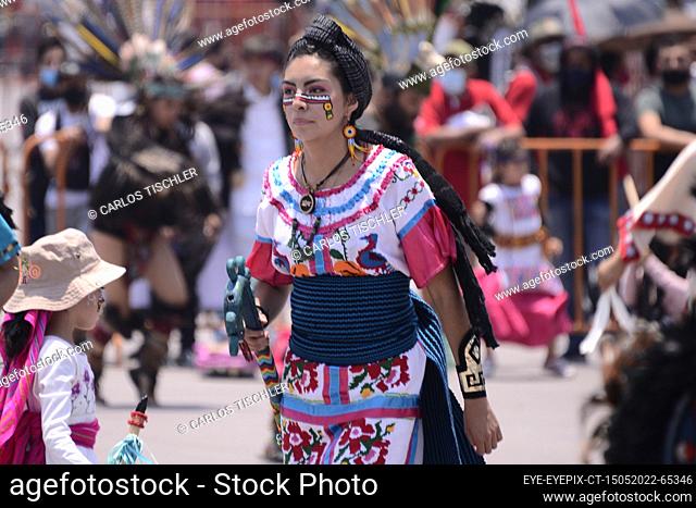 MEXICO CITY, MEXICO - MAY 15, 2022: A person dressed in pre-Hispanic clothing takes part during the traditional Pre-Hispanic dance of ‘Concheros’ at Mexico city...