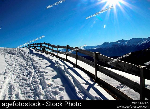 Winter hike to the Wang Alm 1751m in the Gaistal, Austria, Tyrol, vacation, winter, hiking trail, fence, sun