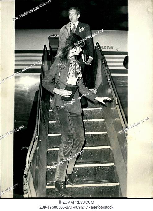 May 05, 1968 - The Shrimp on day trip to Milan. Photo Shows: Model Jean Shrimpton, followed by actor Daving Hemmings, leaving the aircraft at London Airport...