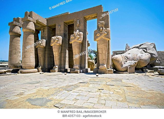 Osiris-pillars and the remains of a colossal statue of Ramses, Ramesseum Temple, Luxor, Egypt