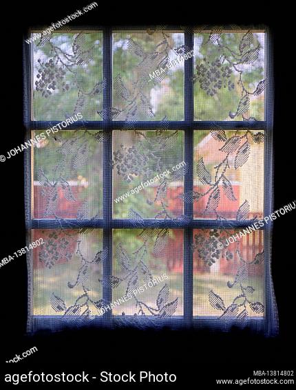 Europe, Denmark, North Jutland, Skagen. View through the curtains into the garden of the Anchers Hus