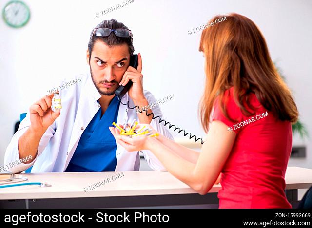 Female diabetic patient visiting young doctor