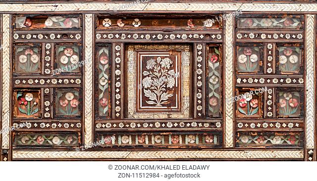 Closeup of wooden seamless floral pattern ornaments on old wooden chair