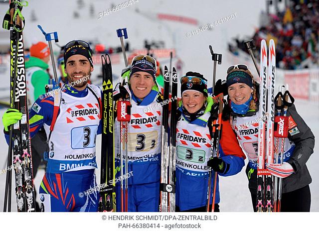 The winning French team including Martin Fourcade (L-R), Quentin Fillon Maillet, Marie Dorin Habert and Anais Bescond pose after winning the mixed relay...