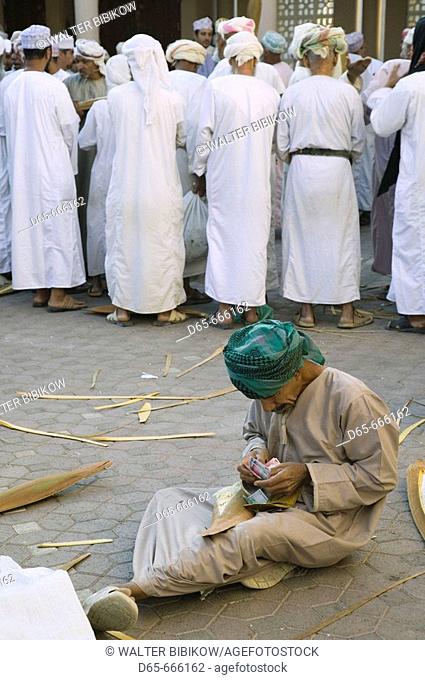 OMAN-Western Hajar Mountains-Nizwa: Omani Farmers at Date Palm Seed Pod Auction at Nizwa Souk
