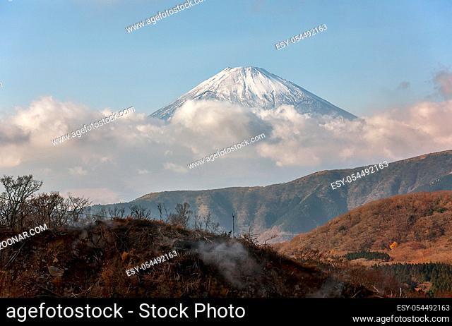The scenic view of Mount Fuji summit in the clouds from the Hakone mountain. Hakone area. Kanagawa Prefecture. Honshu. Japan