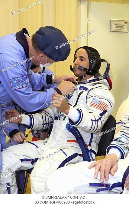 At the Baikonur Cosmodrome in Kazakhstan, Expedition 3132 Flight Engineer Joe Acaba of NASA suits up for a fit check dress rehearsal May 3
