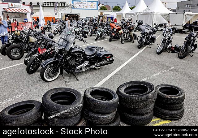 24 June 2022, Hamburg: Countless motorcycles are parked at the Harley Days event site. Europe's largest inner-city biker meeting celebrates the kick-off
