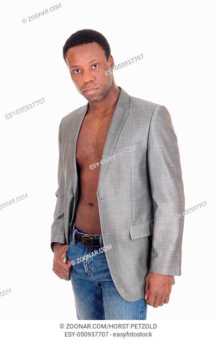 A handsome African American man standing, wearing a jacket and no shirt, looking serious, isolated for white background