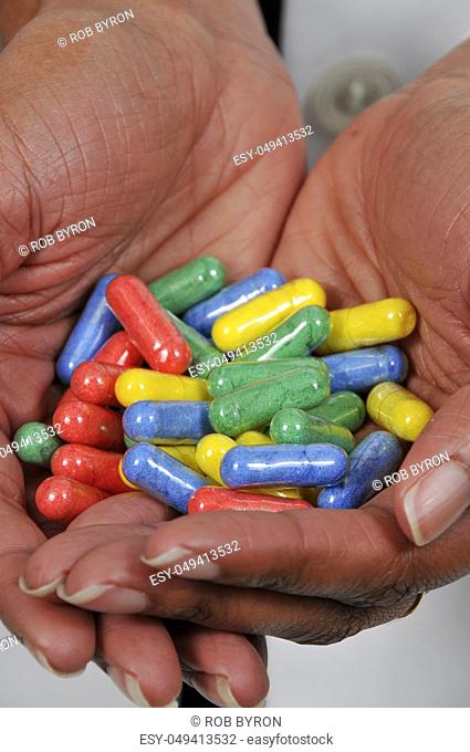 Woman holding prescription medicine narcotics or opioids