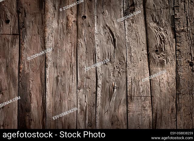 Weathered gray wood planks background with nice studio lighting and elegant vignetting to draw the attention