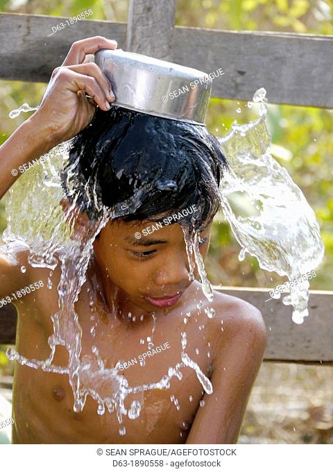 CAMBODIA. Projects of DPA in Stung Treng, supported by SCIAF. Children washing at a well in Kamphun village