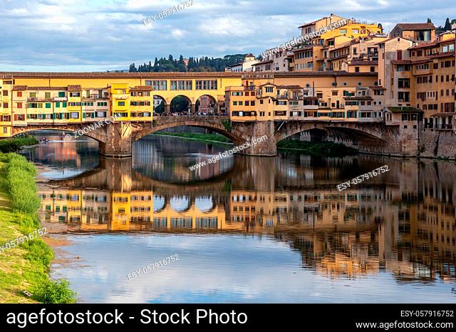 FLORENCE, TUSCANY/ITALY - OCTOBER 18 : View of buildings along and across the River Arno in Florence on October 18, 2019. Unidentified people