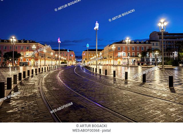 France, Provence-Alpes-Cote d'Azur, Nice, tramway on Place Massena at blue hour