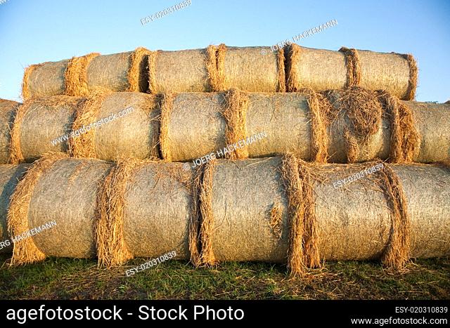 bale of straw with blue sky