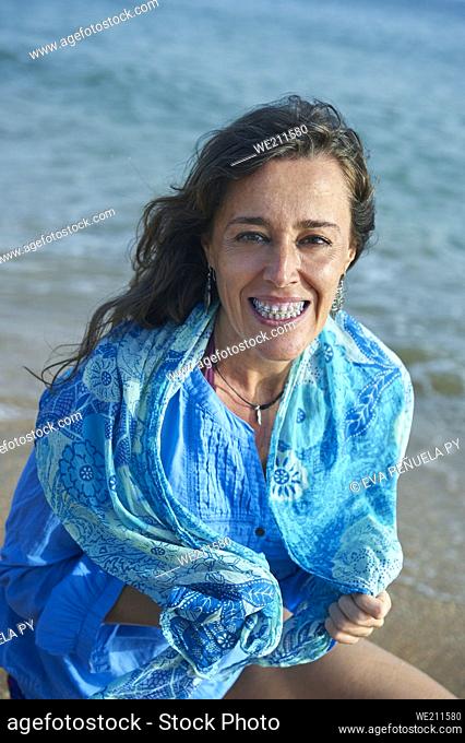 mature woman enjoying different moments on the beach