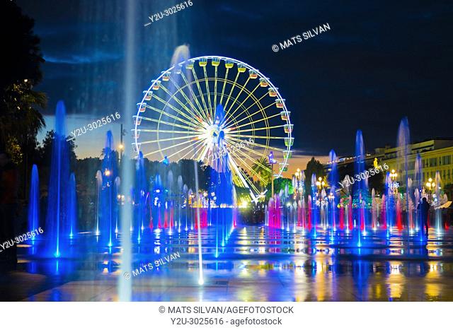 Water Fountain and Ferris Wheel in Dusk in Nice in Provence-Alpes-Côte d'Azur, France