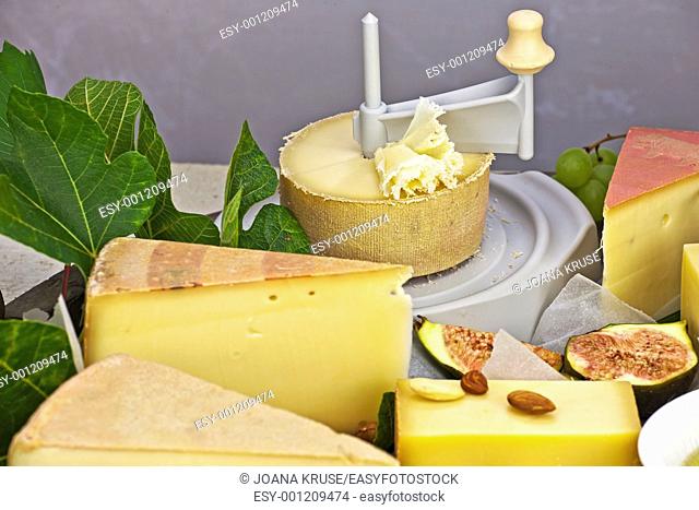 a rich cheese plate, covered as a buffet, consisting of a variety of Swiss cheeses