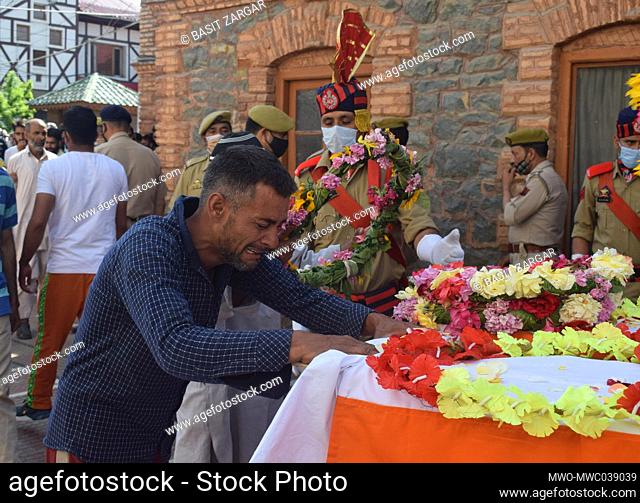Sopore, Kashmir. June 12th 2021. Family members crying during wreath laying ceremony of two policemen who were killed. At least two security personnel and two...