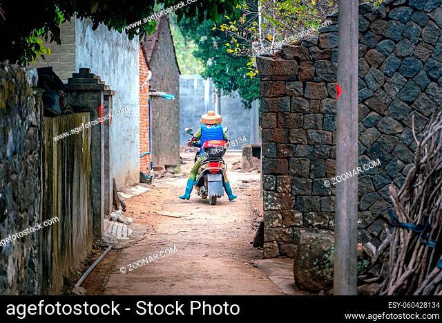 The rural street view of old traditional fisherman village on Hainan in China