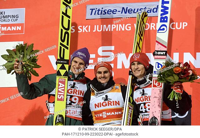 Andreas Wellinger (2nd) of Germany, winner RichardÂ Freitag of Germany and Daniel Andre TandeÂ (3rd)Â of Norway (l-r) on the podium at the FIS Ski Jumping World...