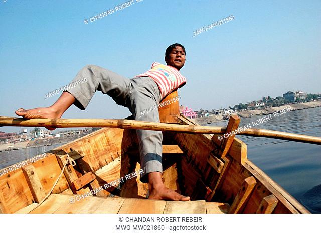 Sujon, 12 years old, had been born without hands but he takes part in the struggle for survival and ferries people across the Buriganga river Sadarghat in Old...