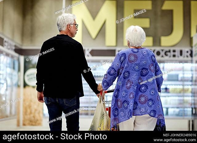 Senior couple doing shopping in supermarket