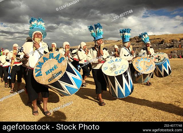 Indigenous people wearing traditional costumes during a performance with their pan flutes and drums at the Inti Raymi Festival in Saqsaywaman Archaeological...