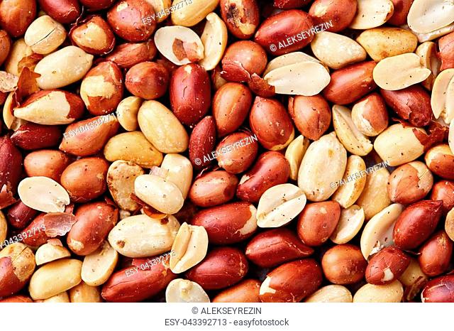 Close up mixed peanuts background, top view, food background. Organic nutritious ingredient. Gourmet appetizer. Tasty roast snack. Food concept