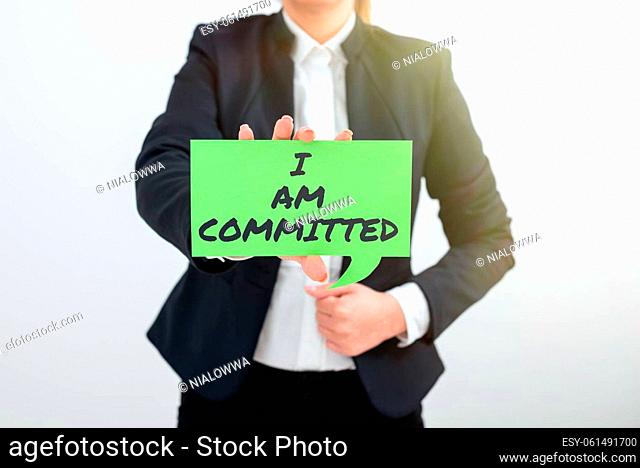 Inspiration showing sign I Am Committed, Business concept To be engage with a cause or someone in particular Commitment Lady in suit holding pen symbolizing...