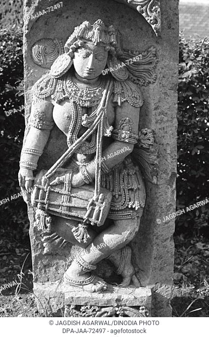 Drummer sculpture at Halebid , Karnataka , India