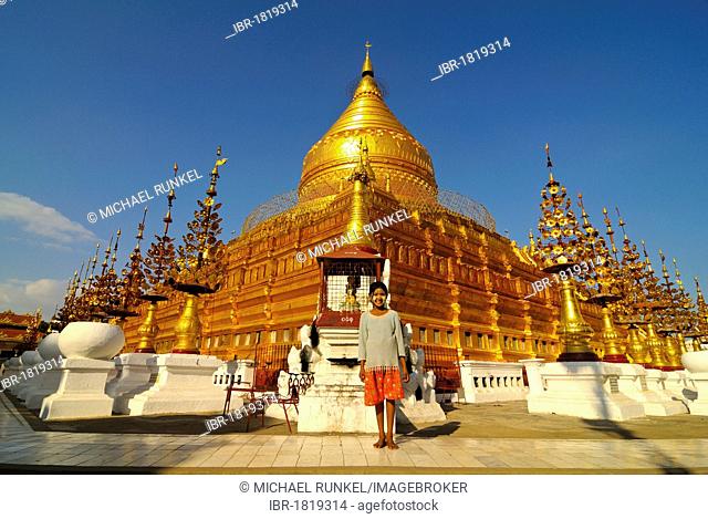 Girl in front of the Shwezigon Pagoda, Bagan, Myanmar, Burma, Southeast Asia, Asia