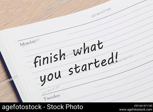 A finish what you started diary reminder appointment open on desk